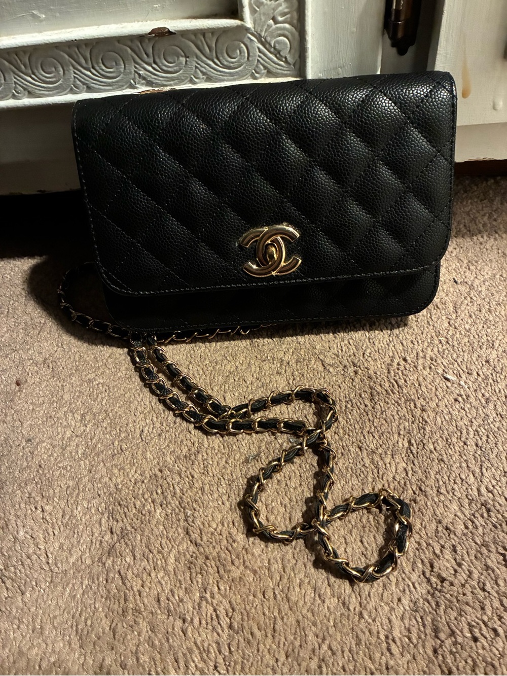 Black Quilted Crossbody with Gold Chain and CC Turnlock Logo.